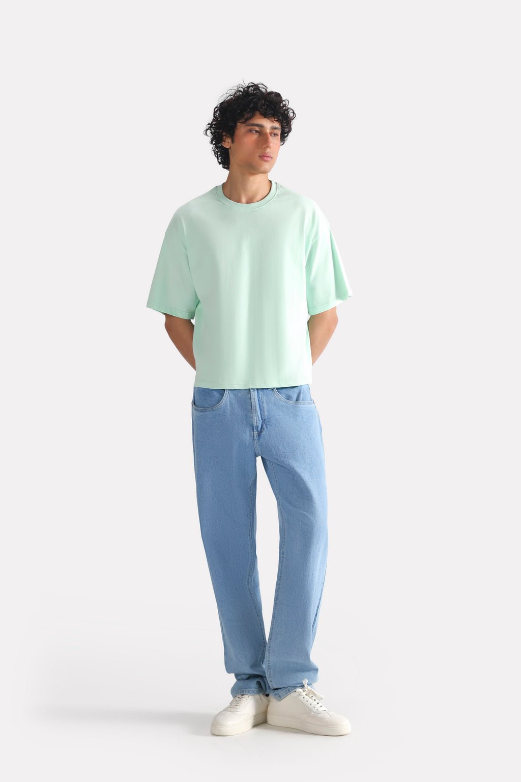 Turquoise (tourquies) drop shoulder cotton t-shirt shown in a styled fit, by SOLA Pakistan.