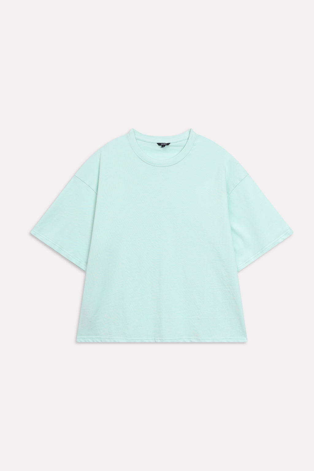 Texture and fabric detail, turquoise (tourquies) drop shoulder cotton t-shirt, by SOLA Pakistan.