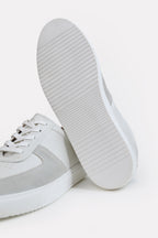 Close-up detail on the white classic leather trainer, by SOLA Pakistan.