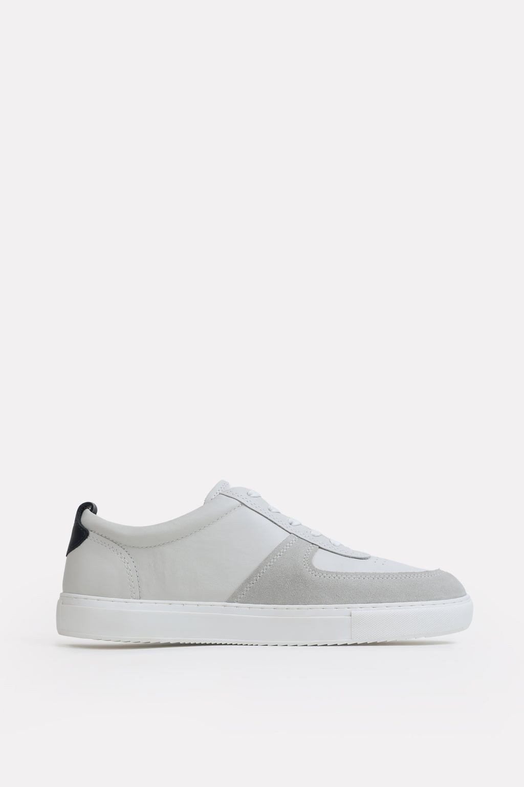 White classic leather trainer, by SOLA Pakistan.