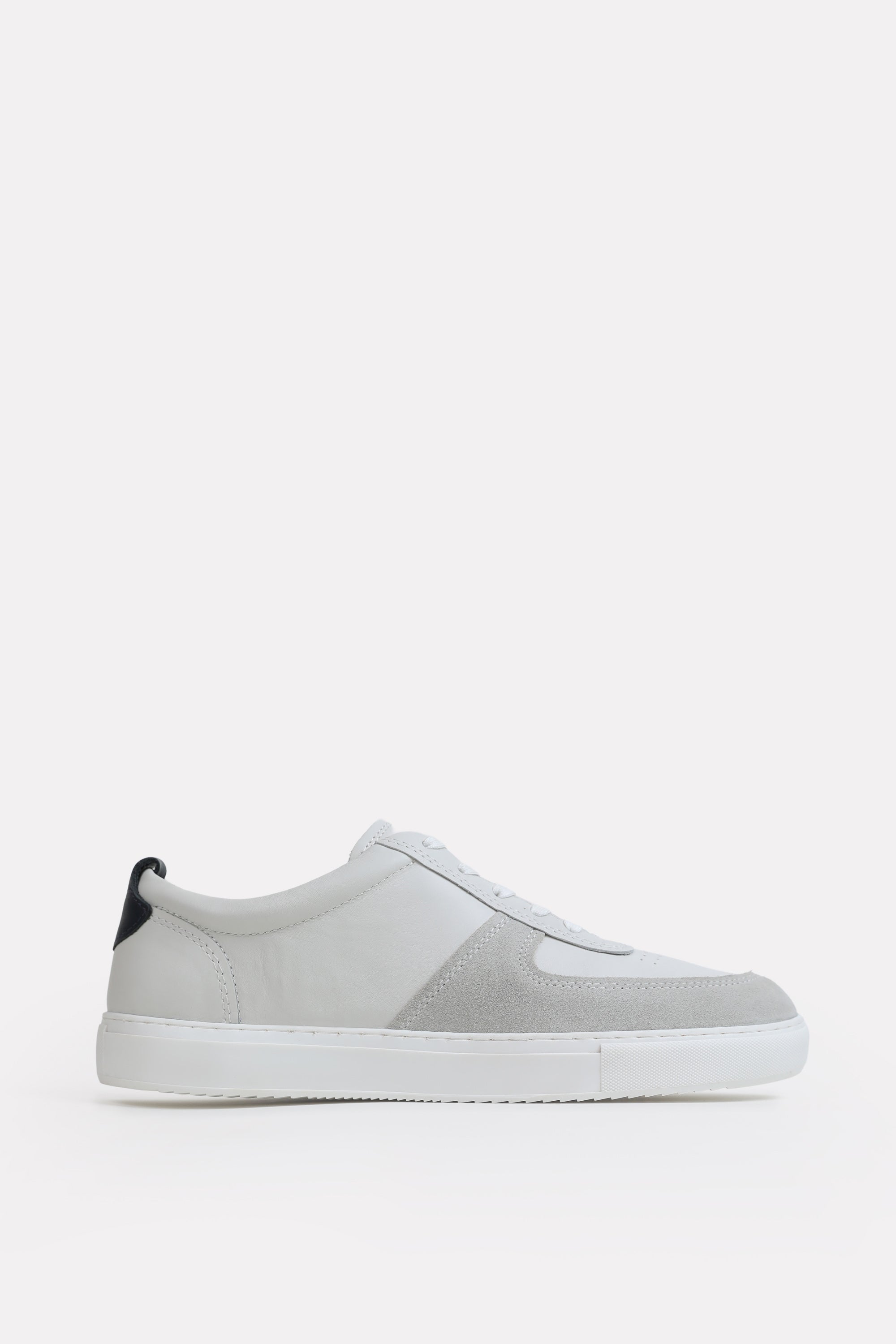 White classic leather trainer, by SOLA Pakistan.