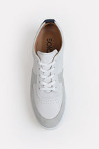 White classic leather trainer shown in detail, by SOLA Pakistan.