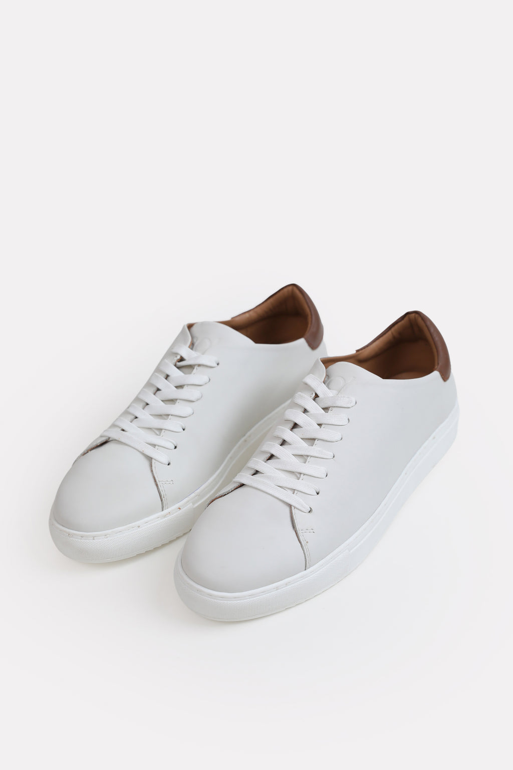 White leather trainers-detailed heel, full styled look, by SOLA Pakistan.