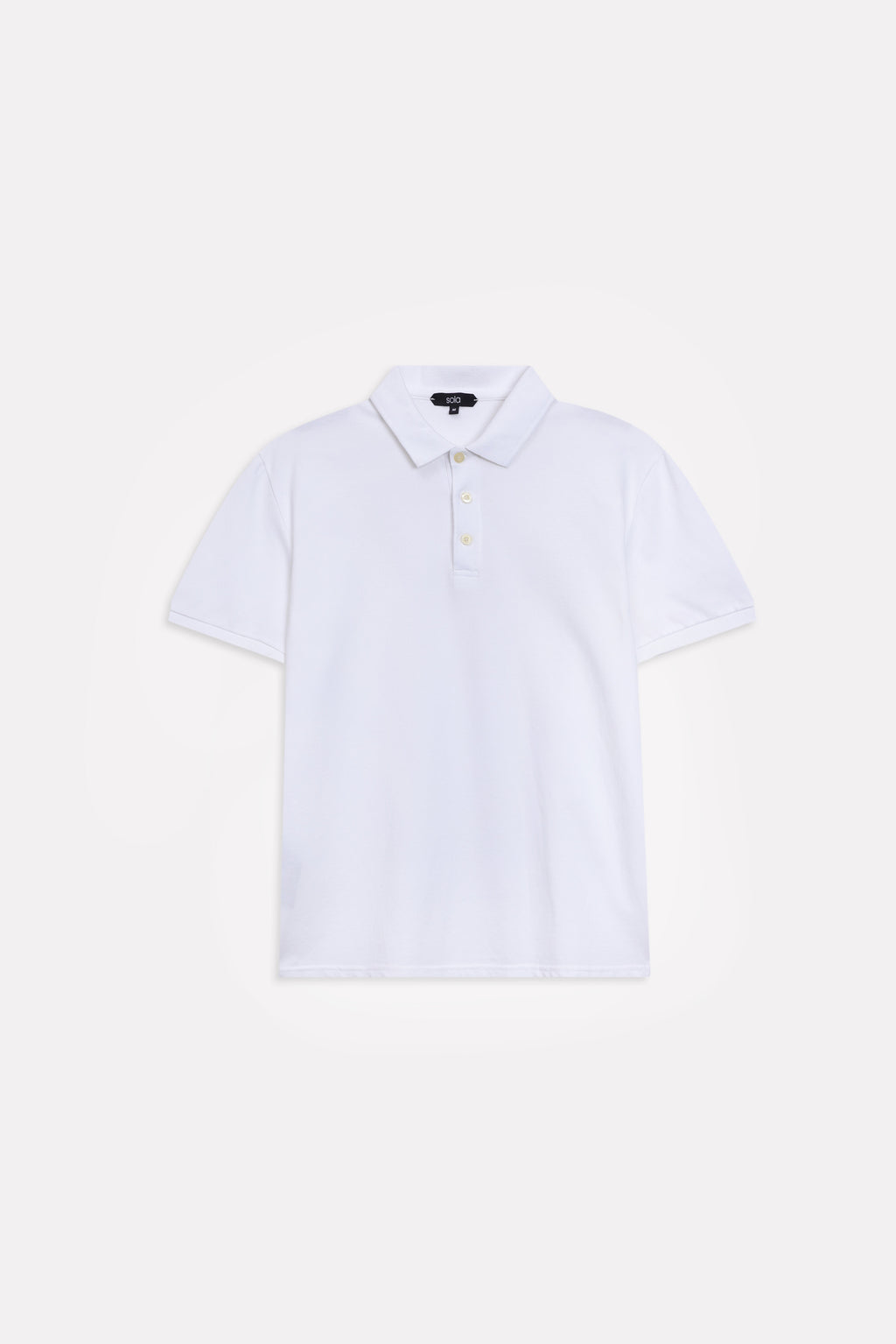 Flat lay of the white micro-textured cotton pique polo, by SOLA Pakistan.