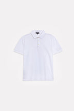 Flat lay of the white micro-textured cotton pique polo, by SOLA Pakistan.