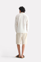 White pop over half-placket shirt, alternate angle, by SOLA Pakistan.
