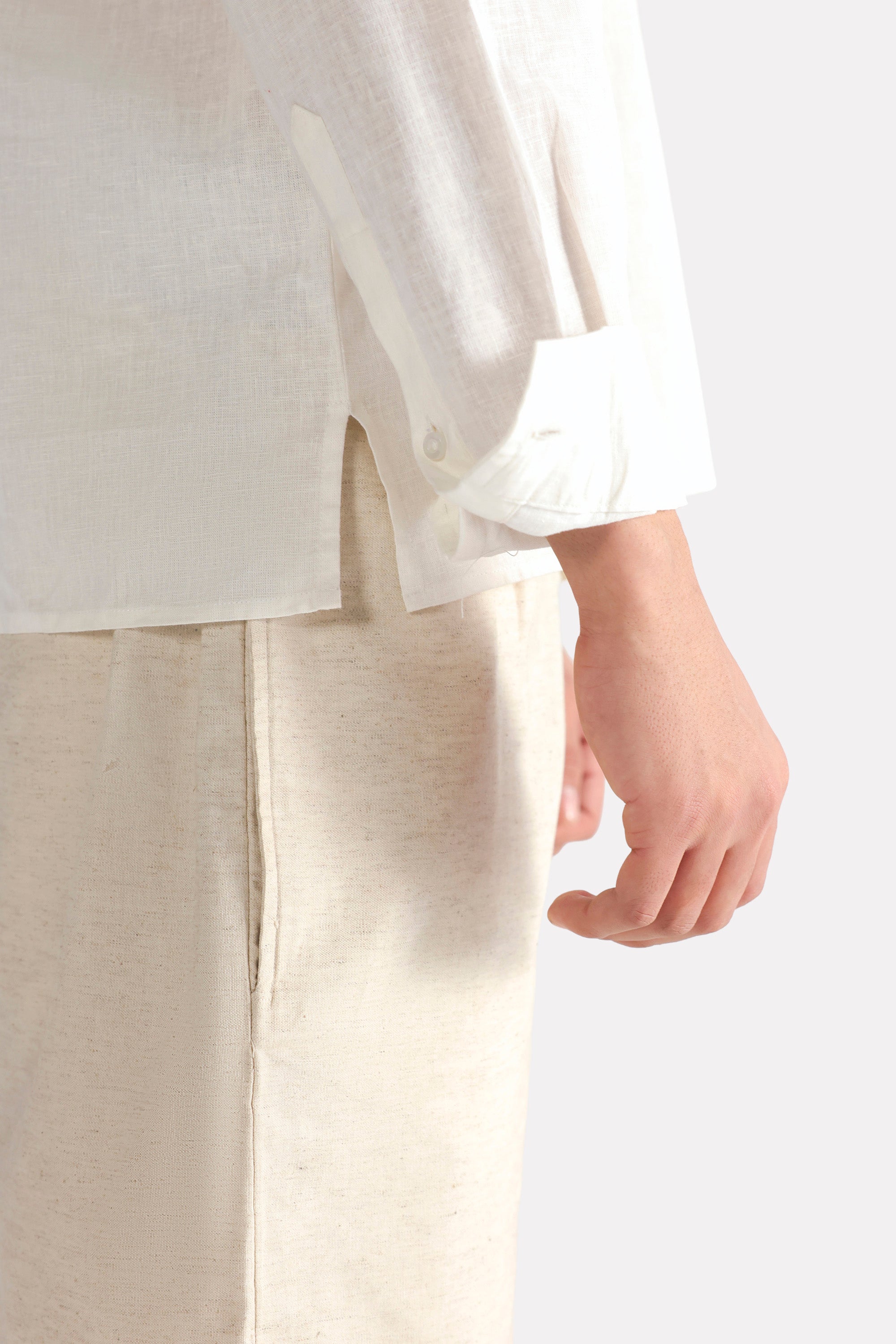 Flat lay of the white pop over half-placket shirt, by SOLA Pakistan.