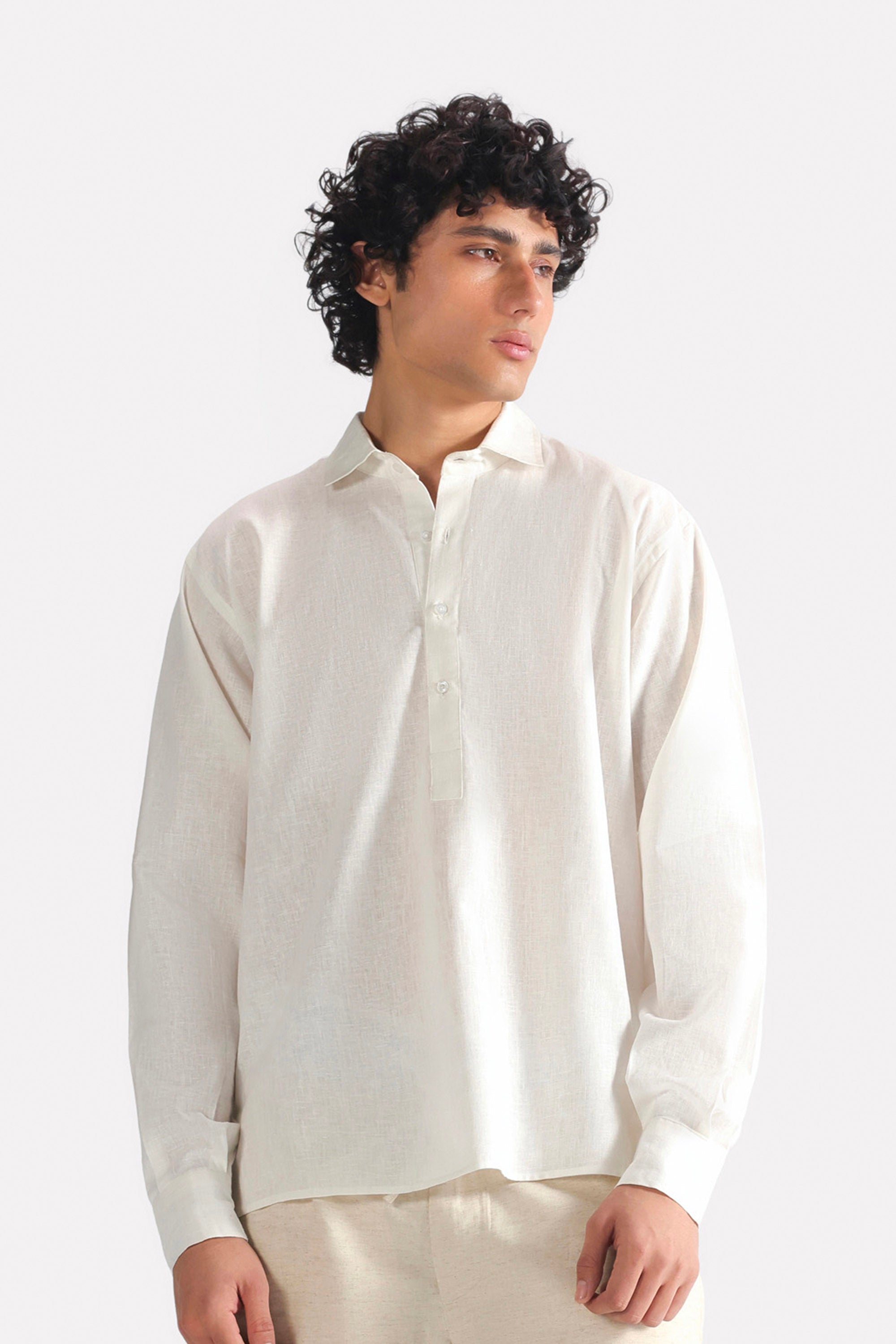 White pop over half-placket shirt in cotton-linen blend, worn by a model, by SOLA Pakistan.