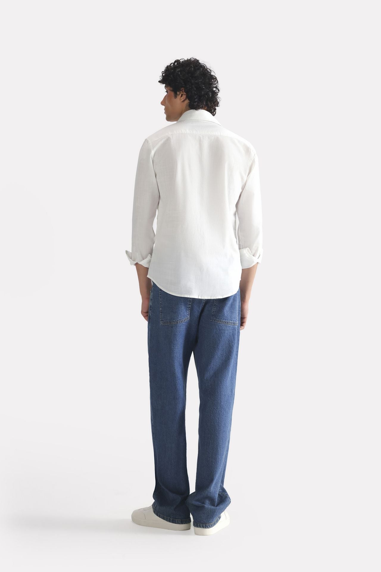 Flat lay of the white regular fit cotton shirt, by SOLA Pakistan.