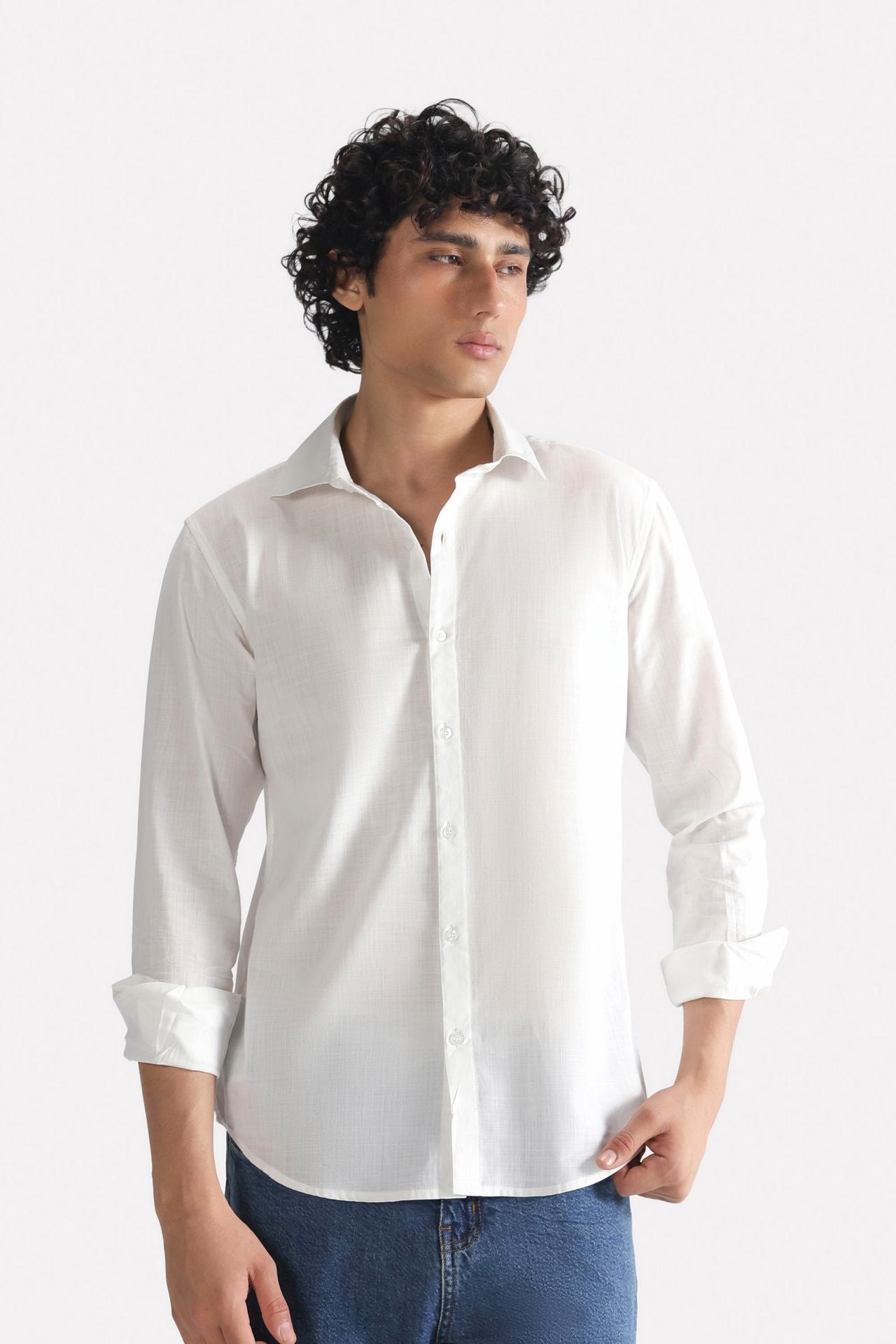 White regular fit cotton shirt, worn by a model, by SOLA Pakistan.