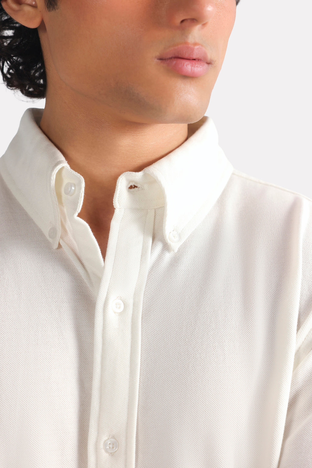 Close-up detail on the white regular fit pique shirt, by SOLA Pakistan.