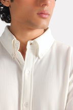 Close-up detail on the white regular fit pique shirt, by SOLA Pakistan.