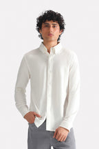 White regular fit pique shirt in cotton, worn by a model, by SOLA Pakistan.