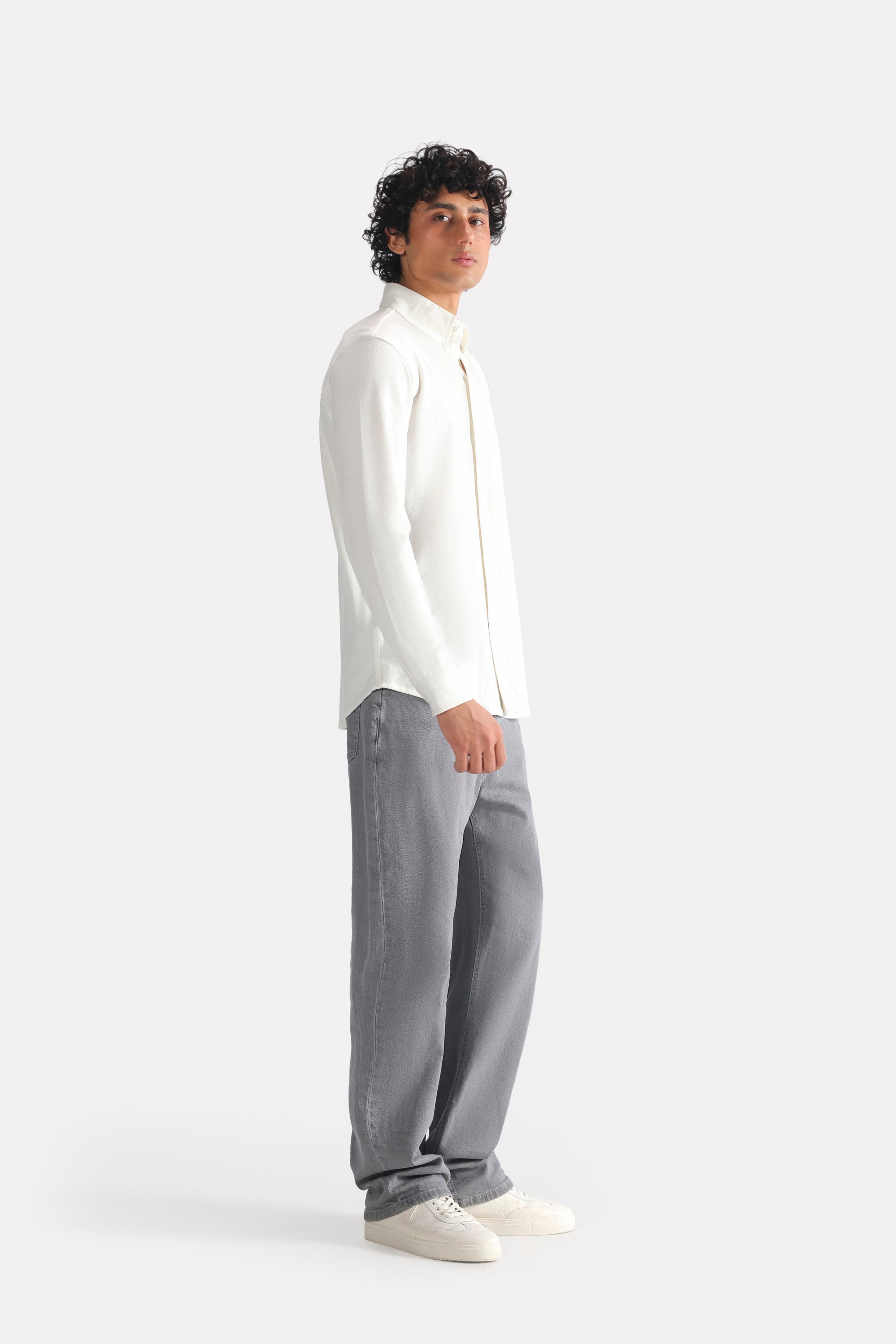 White regular fit pique shirt shown in a styled fit, by SOLA Pakistan.