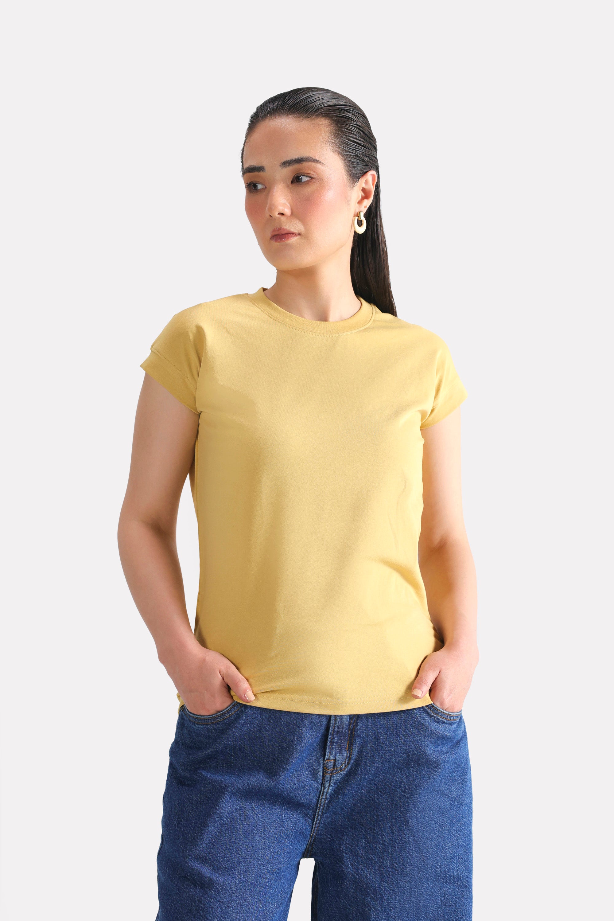 Beige cap sleeve t-shirt in cotton, worn by a model, by SOLA Pakistan.
