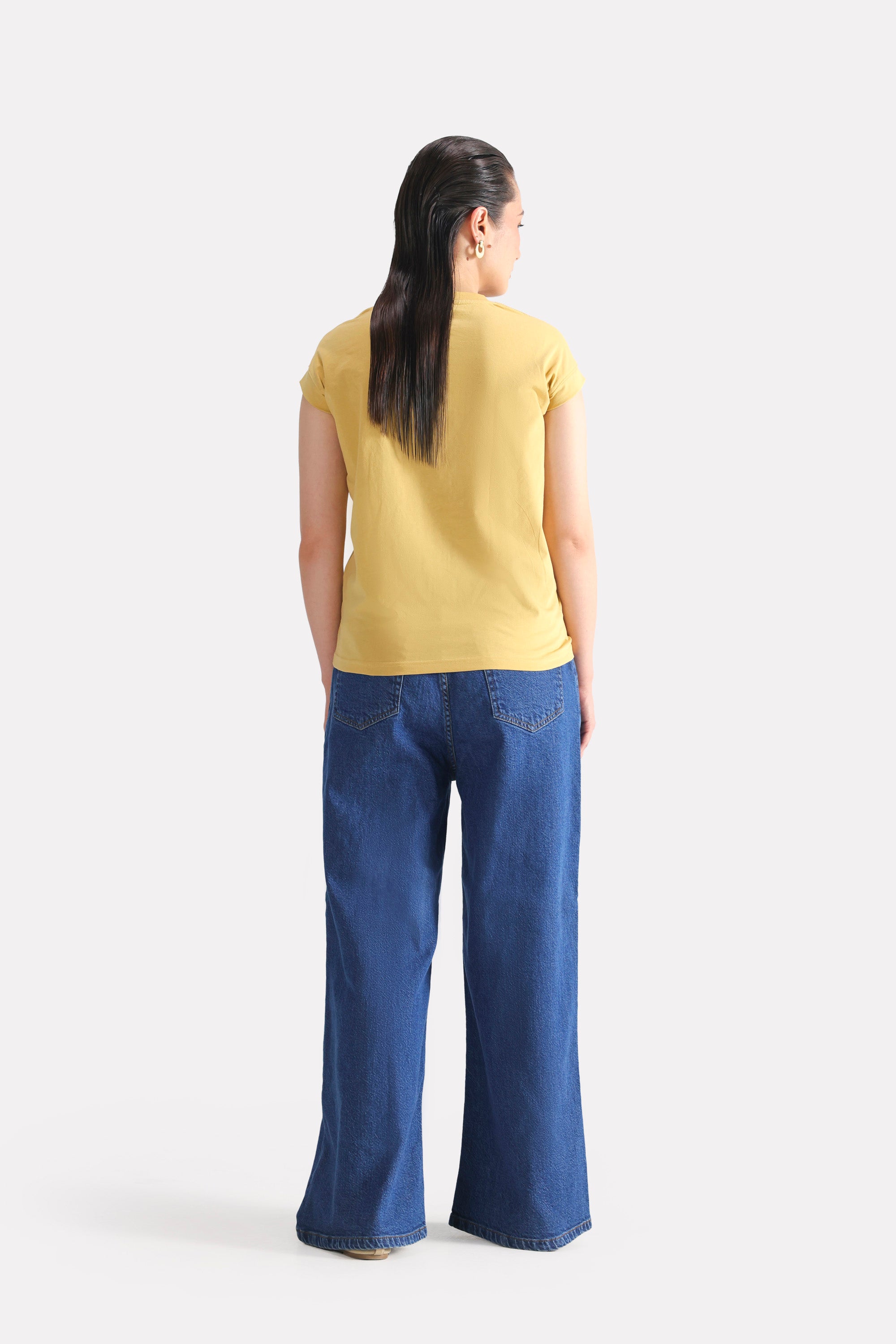 Texture and fabric detail, beige cap sleeve t-shirt, by SOLA Pakistan.