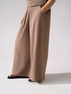 Close-up detail on the beige cozy chic co-ord bottom, by SOLA Pakistan.