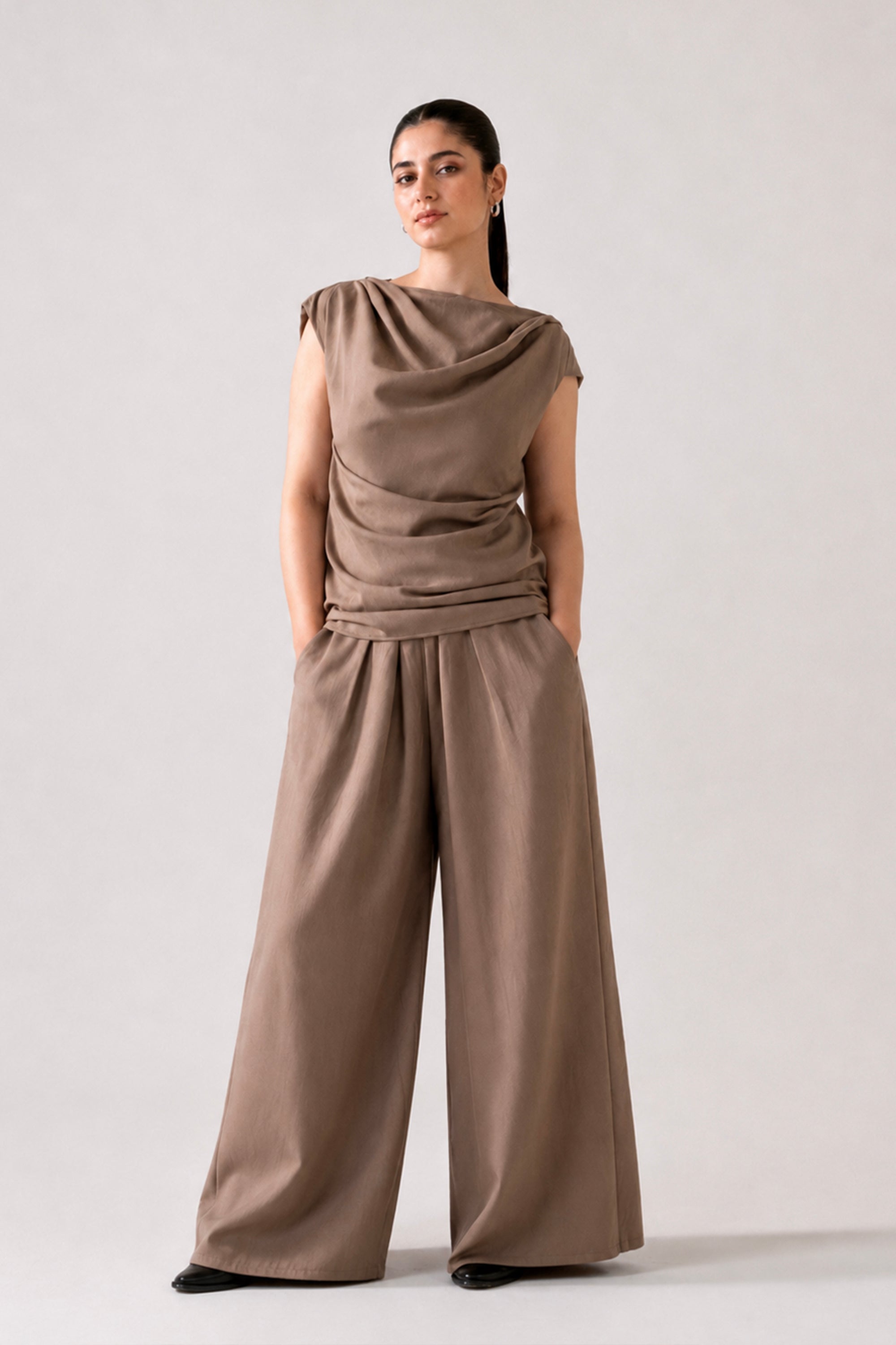 Beige cozy chic co-ord bottom in cotton-linen blend, worn by a model, by SOLA Pakistan.