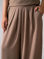 Beige cozy chic co-ord bottom shown in a styled fit, by SOLA Pakistan.