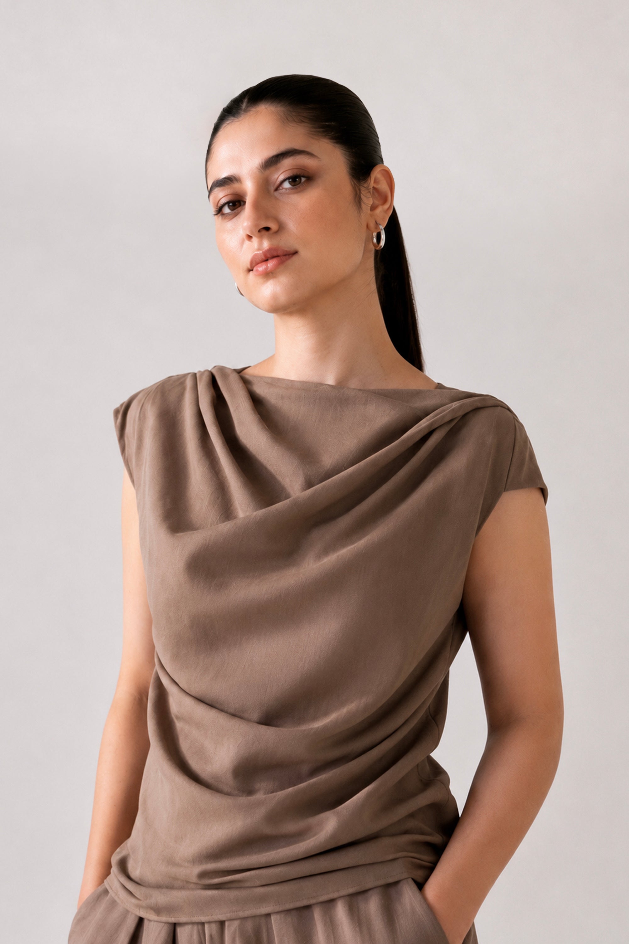 Close-up detail on the beige cozy chic co-ord top, by SOLA Pakistan.