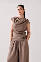 Beige cozy chic co-ord top in cotton-linen blend, worn by a model, by SOLA Pakistan.