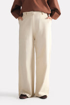 Close-up detail on the beige patch pocket trouser, by SOLA Pakistan.