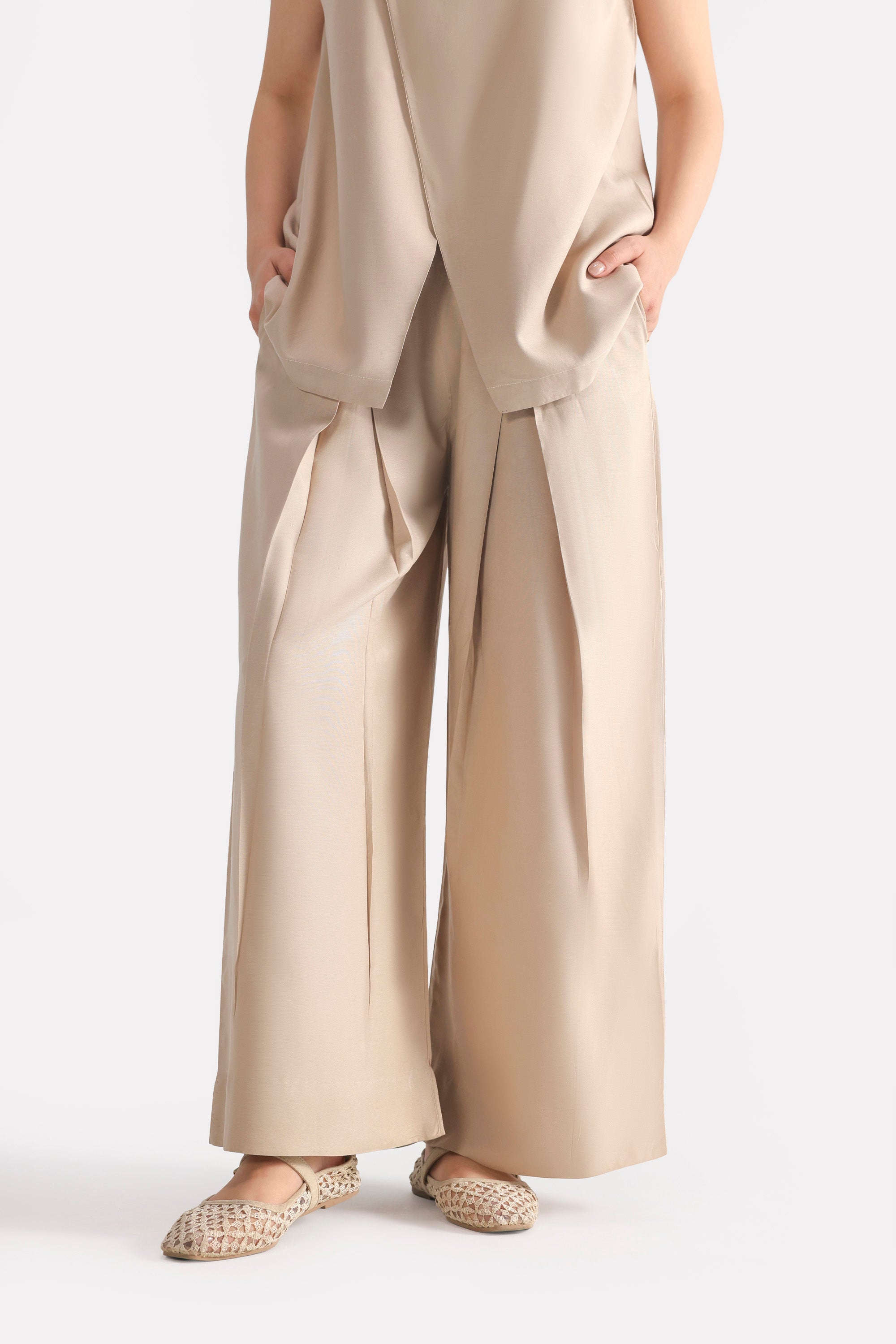 Beige pleated co-ord bottom, full styled look, by SOLA Pakistan.