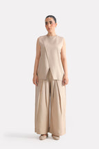 Close-up detail on the beige pleated co-ord top, by SOLA Pakistan.