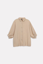 Close-up detail on the beige pleated hem woven top, by SOLA Pakistan.