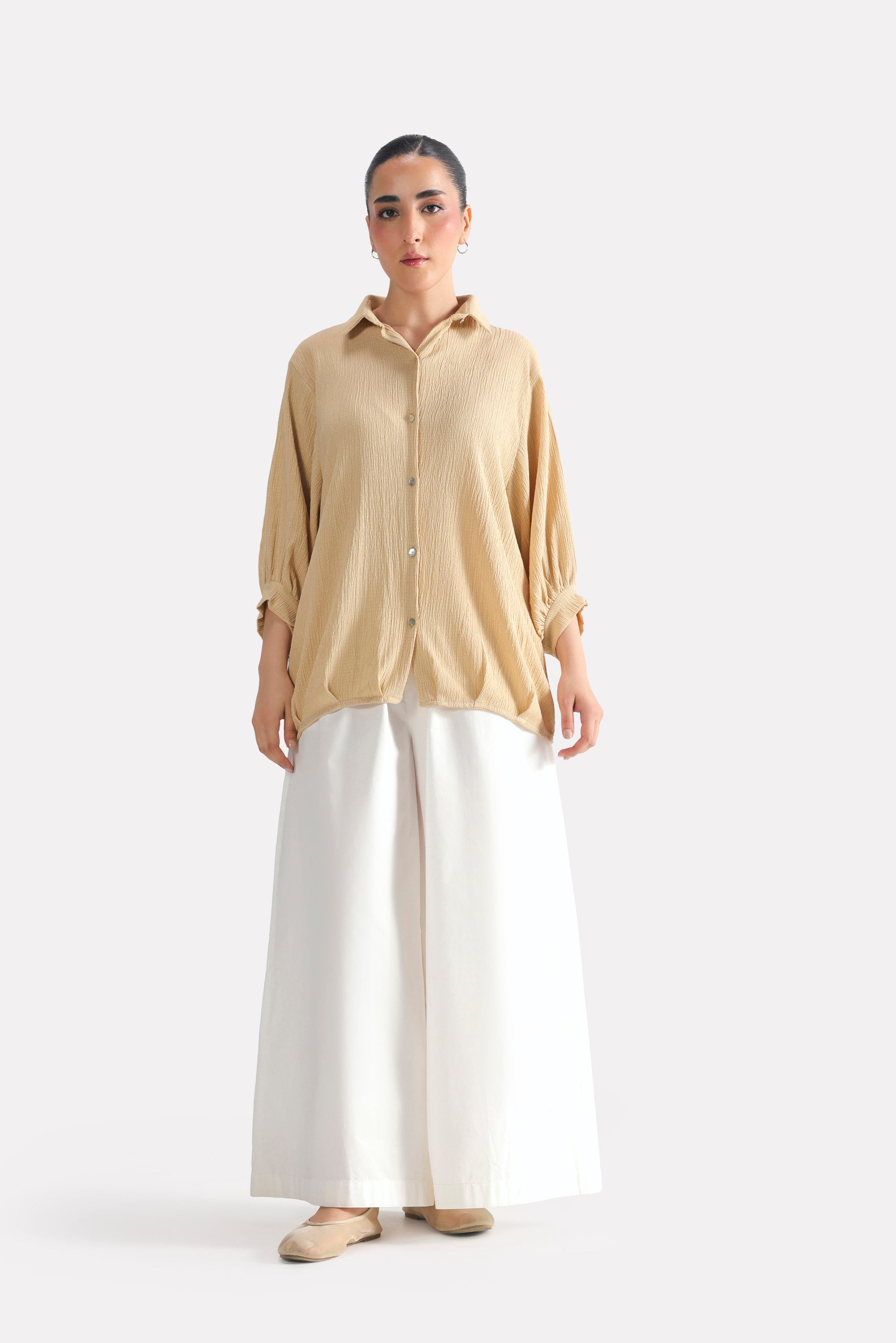 Beige pleated hem woven top, full styled look, by SOLA Pakistan.