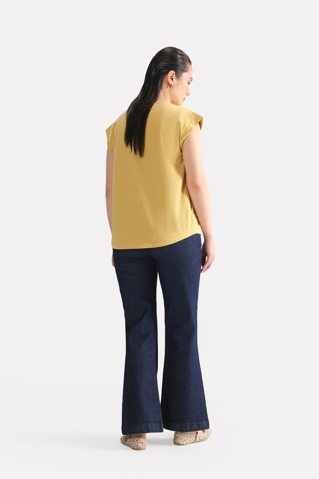 Texture and fabric detail, beige relaxed shoulder-tab t-shirt, by SOLA Pakistan.