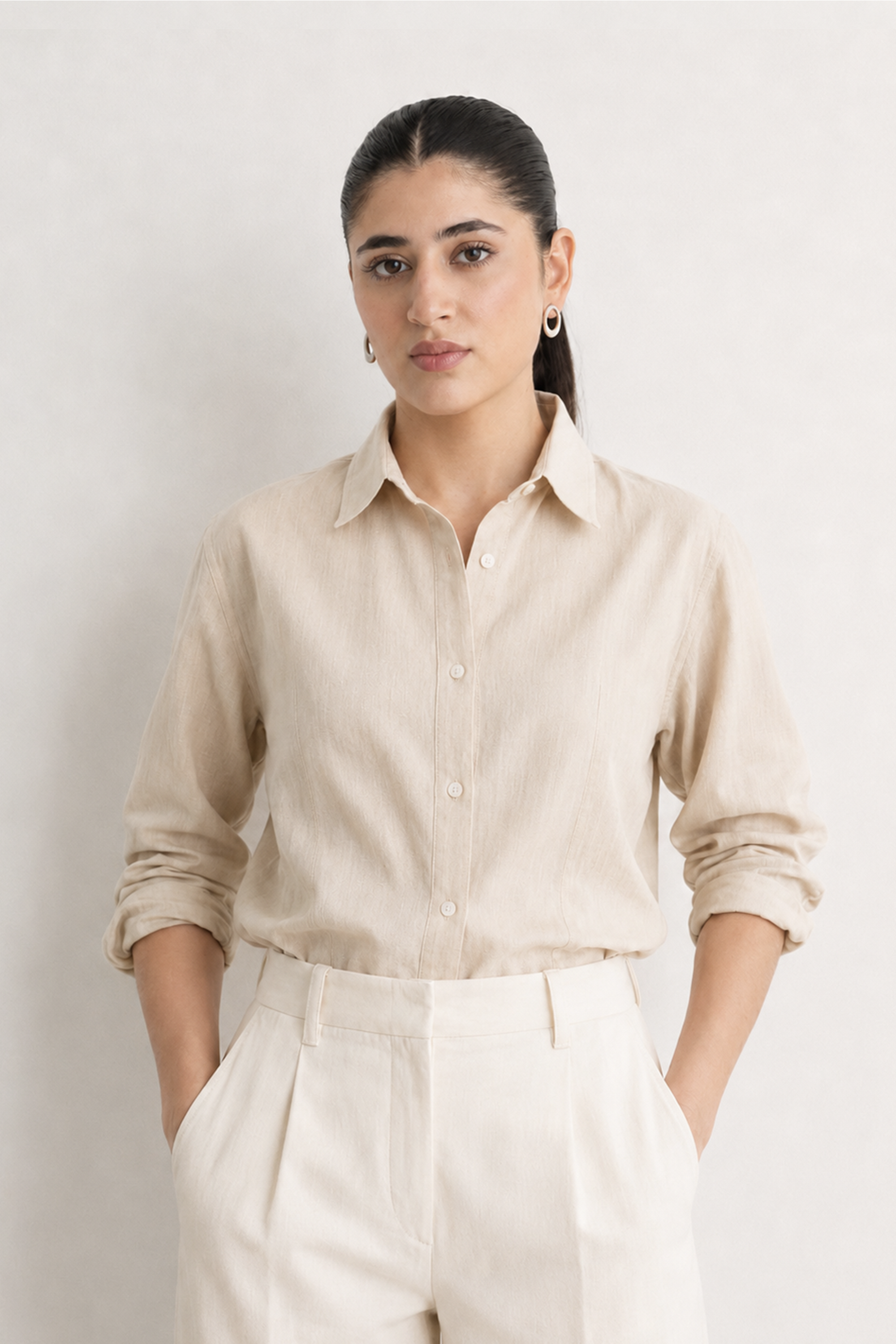 Close-up detail on the beige (sand) refined pleated woven shirt, by SOLA Pakistan.