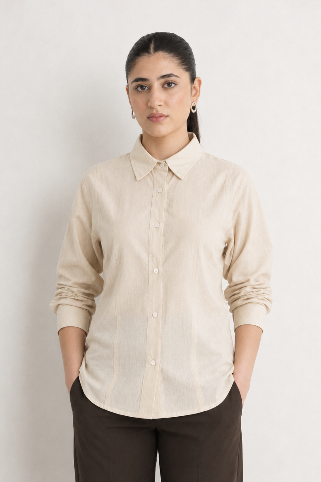 Beige (sand) refined pleated woven shirt in cotton-linen blend, worn by a model, by SOLA Pakistan.