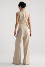 Close-up detail on the beige sleeveless wrap style wide leg jumpsuit co-ord, by SOLA Pakistan.