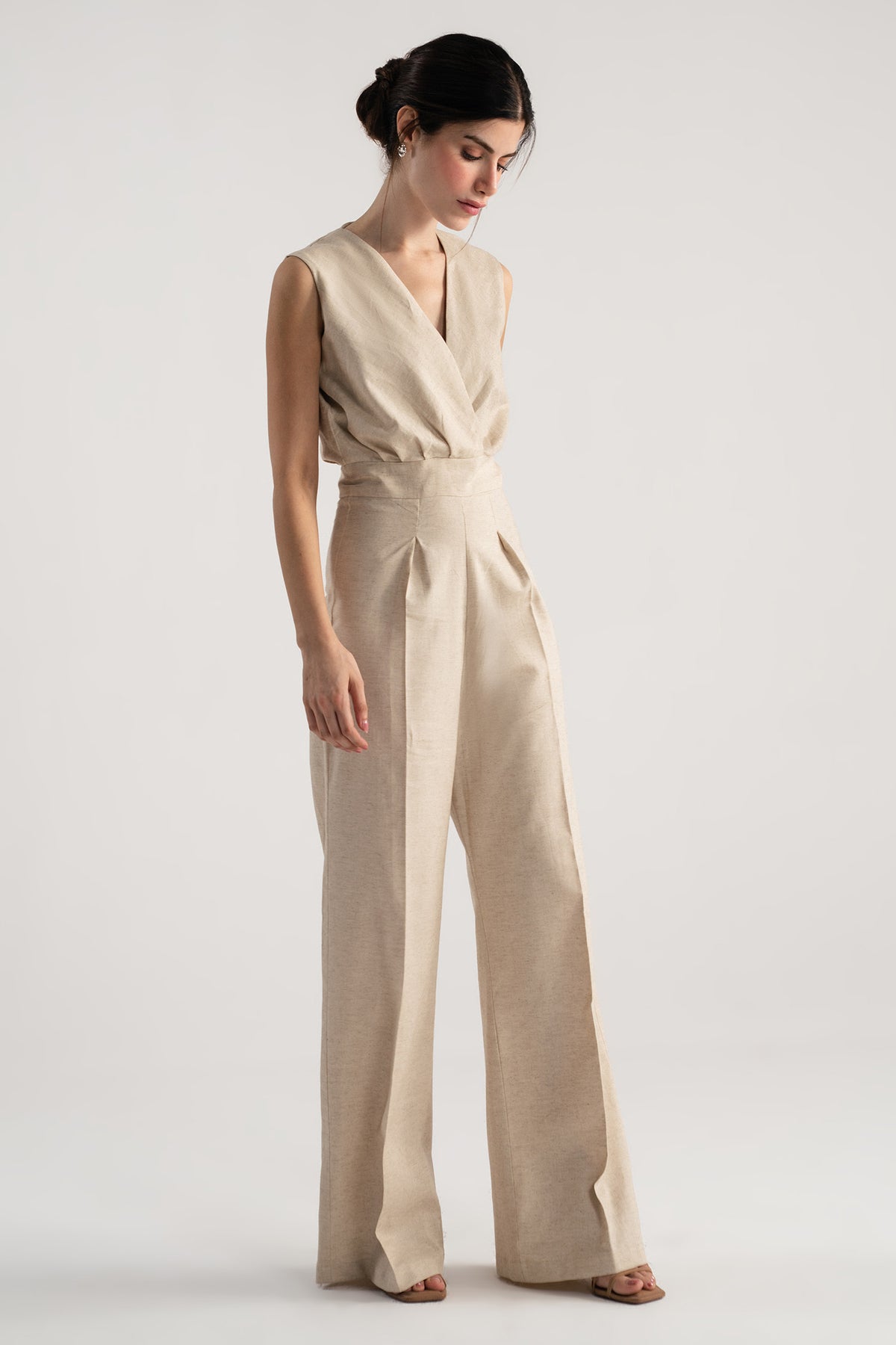 Beige sleeveless wrap style wide leg jumpsuit co-ord, full styled look, by SOLA Pakistan.
