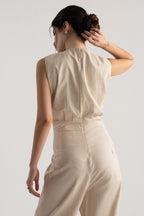 Beige sleeveless wrap style wide leg jumpsuit co-ord shown in a styled fit, by SOLA Pakistan.
