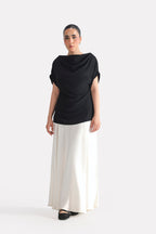 Close-up detail on the black batwing sleeve top, by SOLA Pakistan.