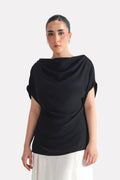 Black batwing sleeve top in polyester-silk blend, worn by a model, by SOLA Pakistan.