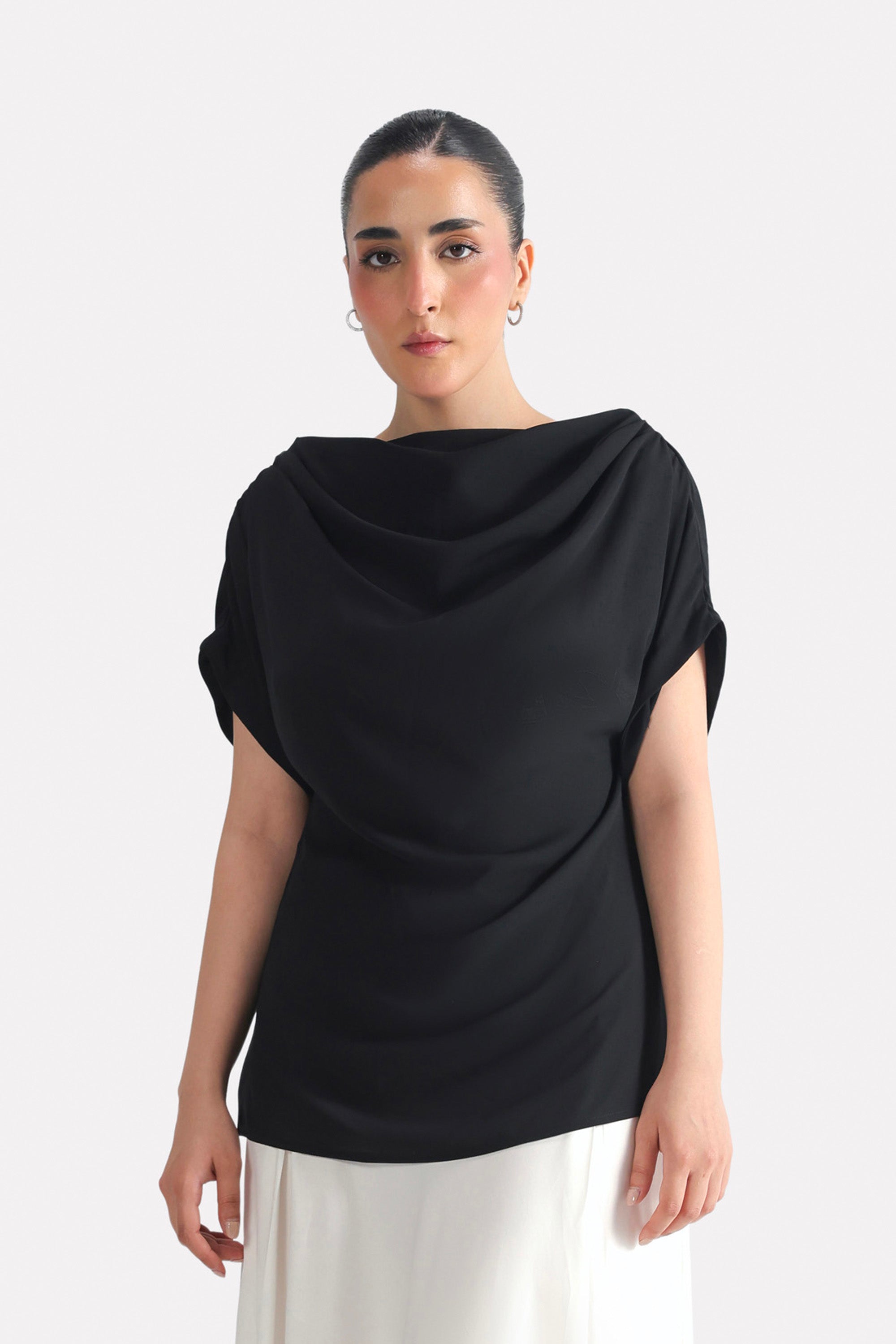 Black batwing sleeve top in polyester-silk blend, worn by a model, by SOLA Pakistan.