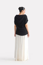 Black batwing sleeve top shown in a styled fit, by SOLA Pakistan.