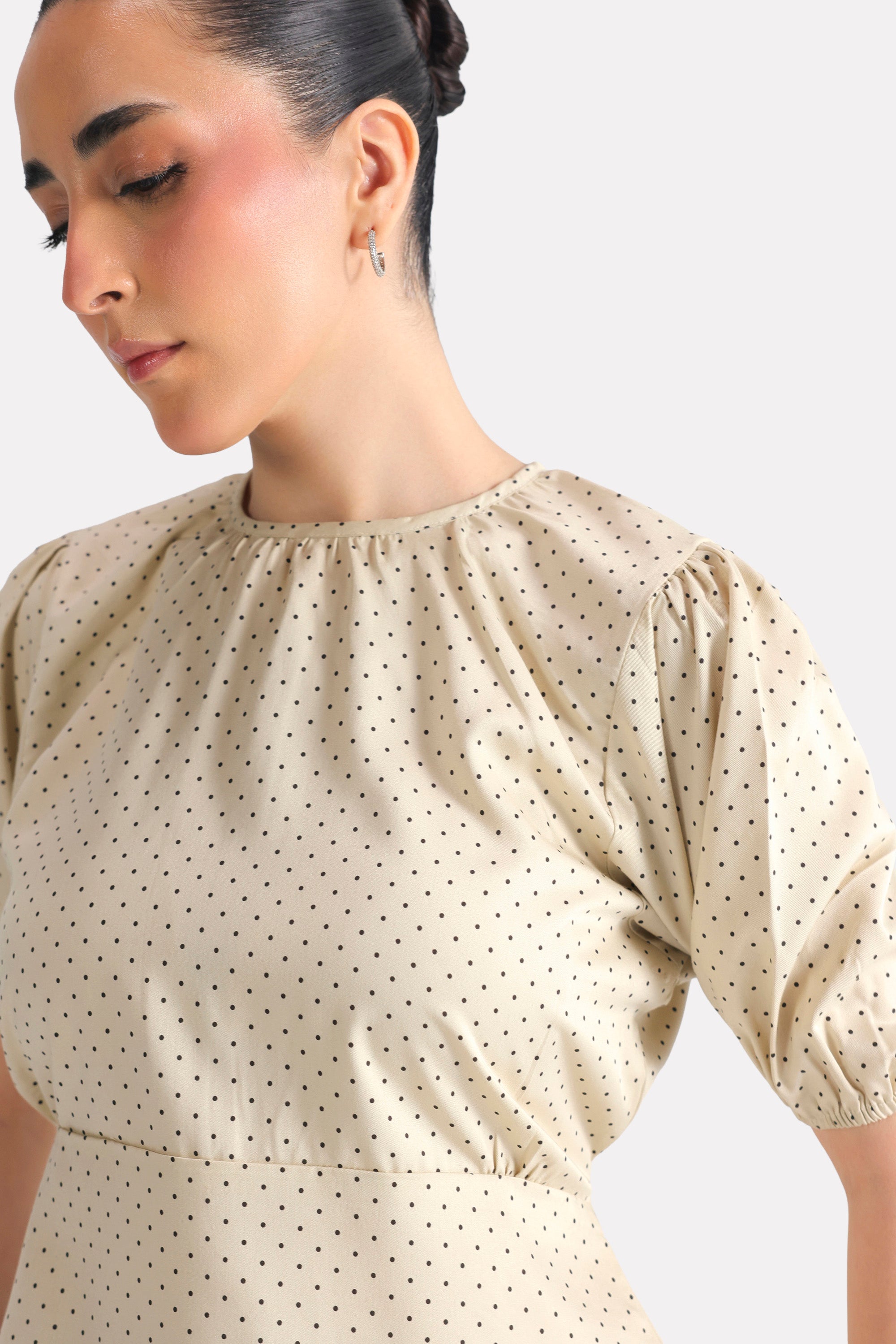 Black dotted print puff sleeve polka dot shirt shown in a styled fit, by SOLA Pakistan.