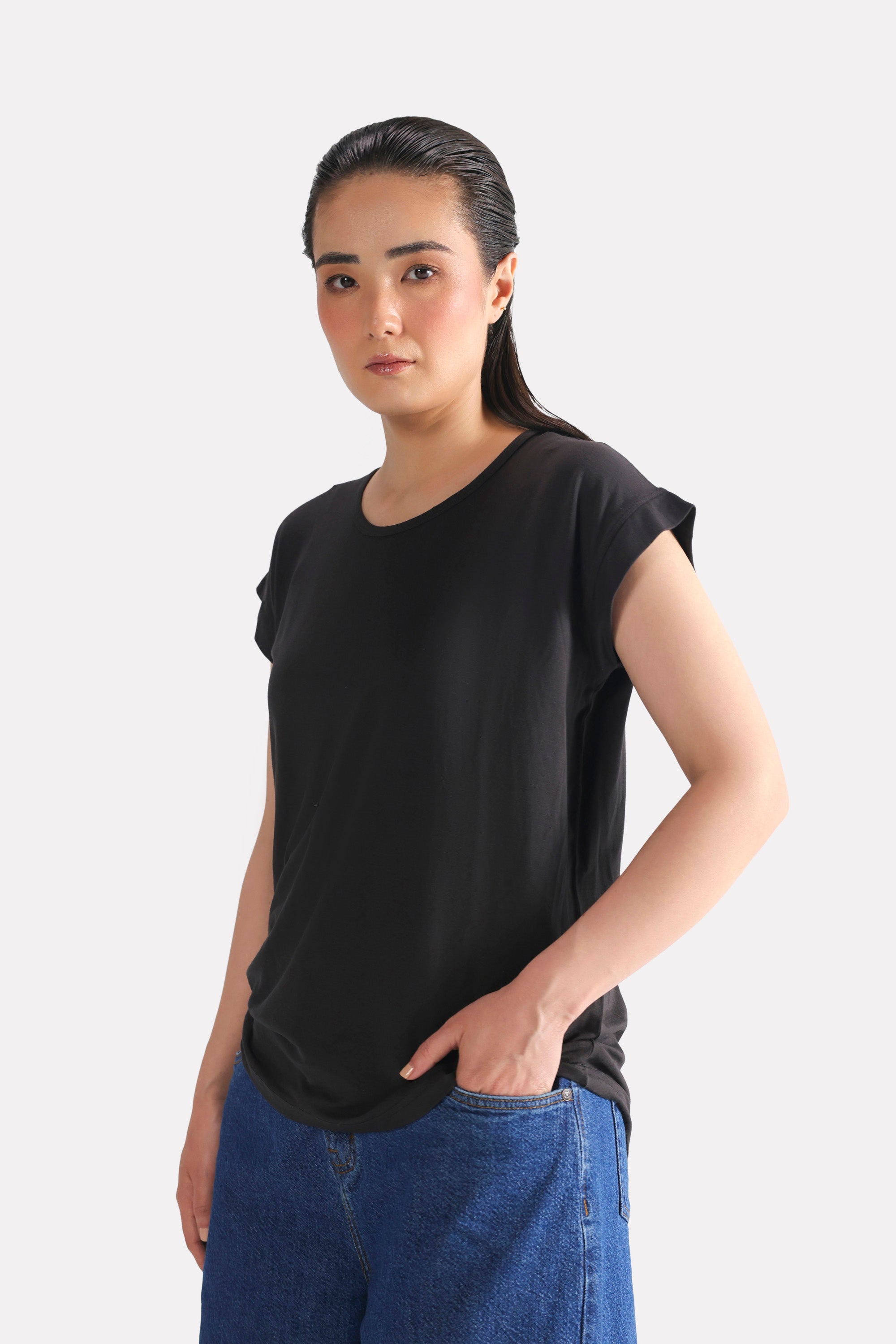 Close-up detail on the black featherweight modal t-shirt, by SOLA Pakistan.