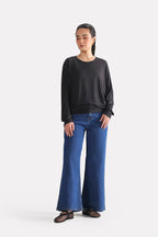 Black fluid sleeve t-shirt, full styled look, by SOLA Pakistan.