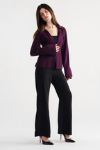 Close-up detail on the black high waisted clean wide leg tailored, by SOLA Pakistan.