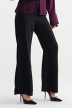 Black high waisted clean wide leg tailored, worn by a model, by SOLA Pakistan.
