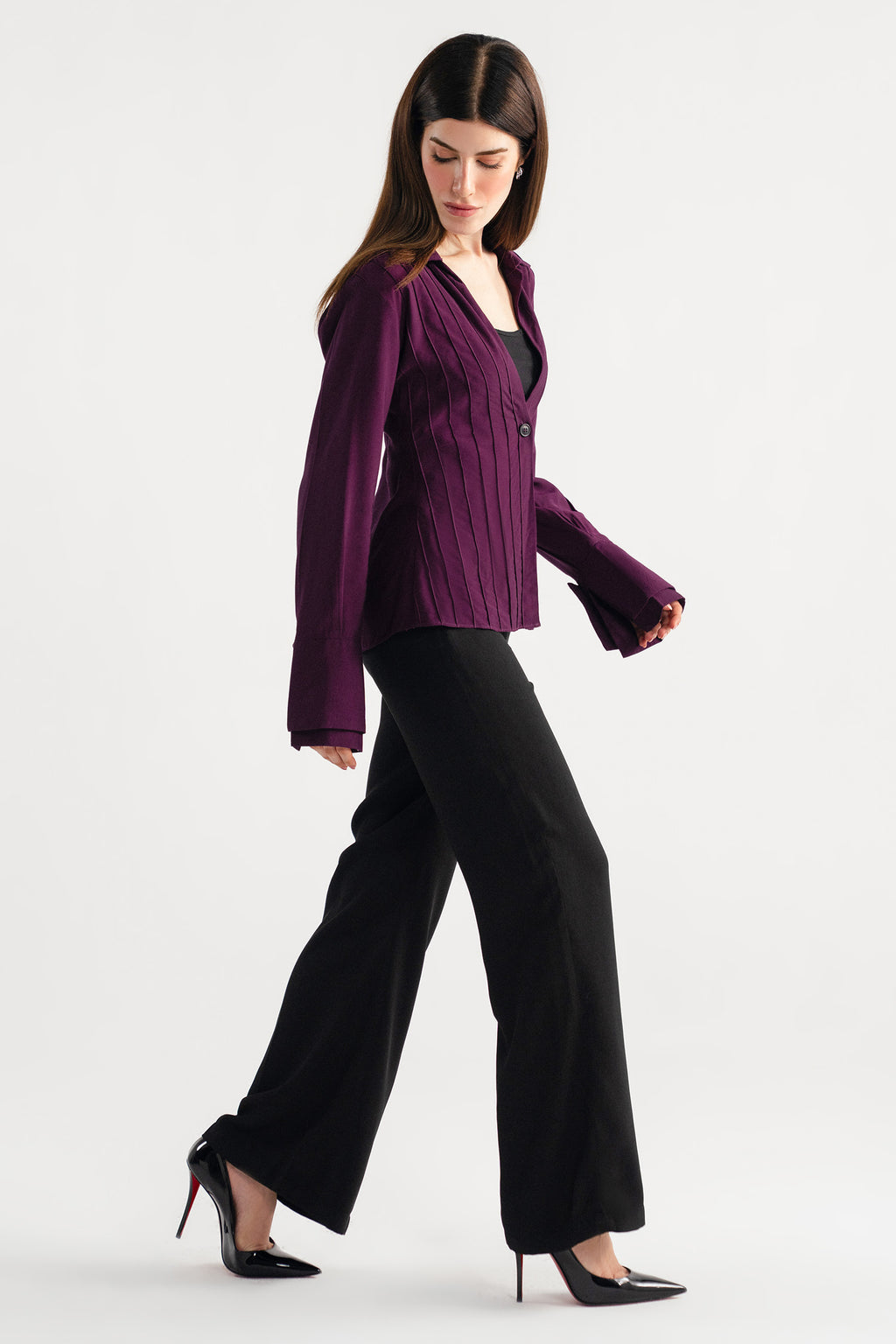 Black high waisted clean wide leg tailored shown in a styled fit, by SOLA Pakistan.