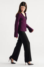 Black high waisted clean wide leg tailored shown in a styled fit, by SOLA Pakistan.