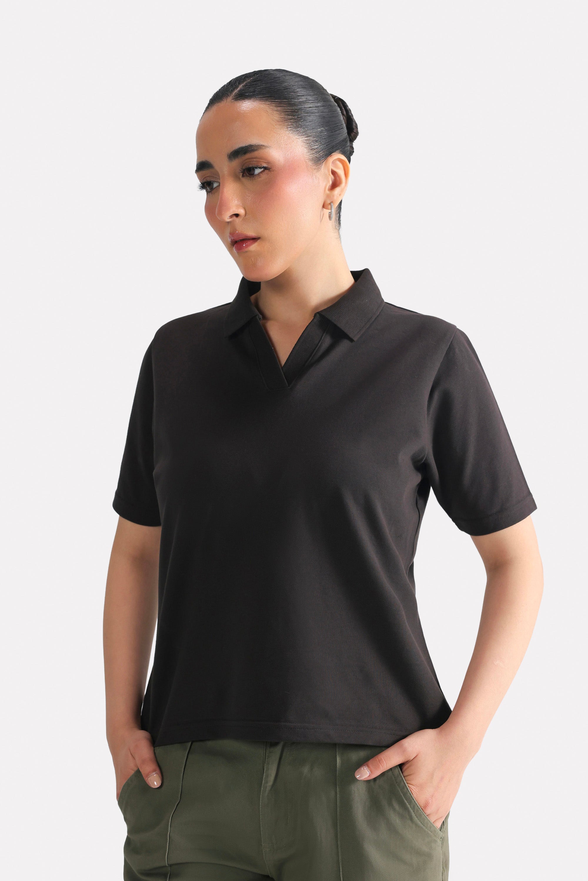 Black jhonny collar polo t-shirt in cotton, worn by a model, by SOLA Pakistan.