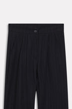 Close-up detail on the black retro wide-leg trouser, by SOLA Pakistan.