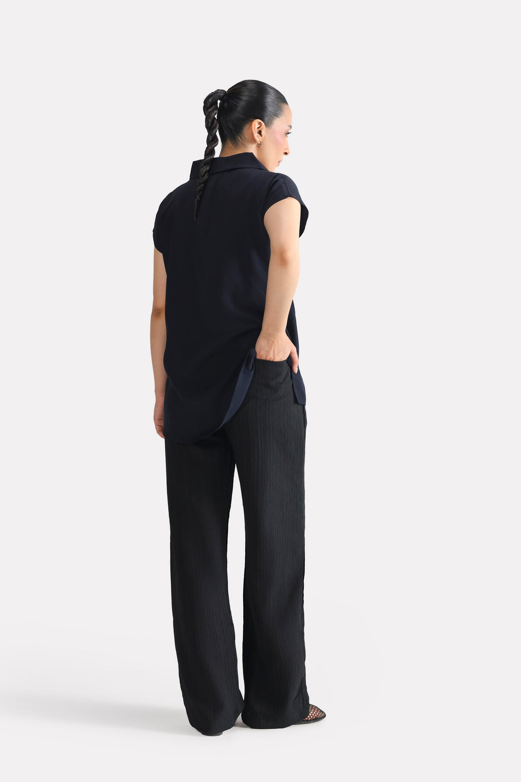 Flat lay of the black retro wide-leg trouser, by SOLA Pakistan.